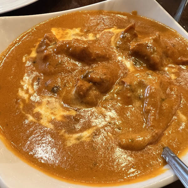 Rangoli signature dishes Butter ChickenChicken 65Palak Chaat